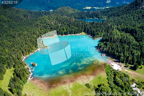 Image of Lake Lago di Fusine Superiore Italy Alps. Aerial FPV drone fligh