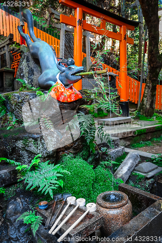 Image of Fox purification fountain at Fushimi Inari Taisha, Kyoto, Japan