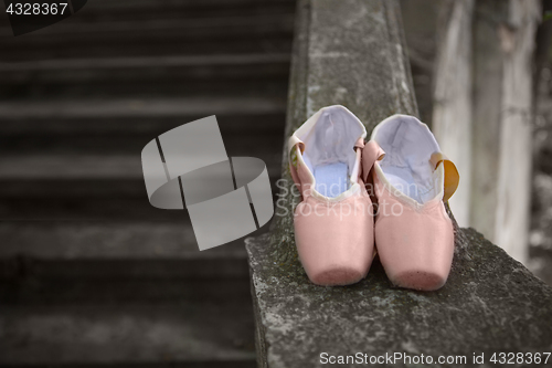 Image of Pointe shoes for a classical ballerina, close-up on concrete