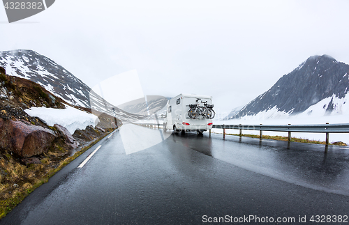 Image of Caravan car travels on the highway.