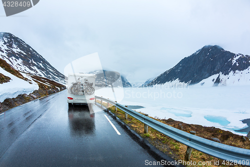 Image of Caravan car travels on the highway.