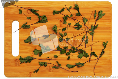 Image of Dried mint on the board.