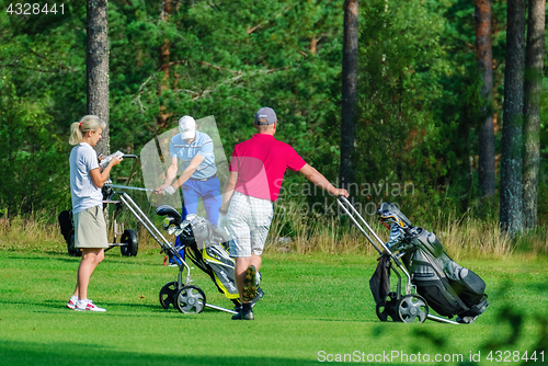 Image of Fans of the game of Golf.