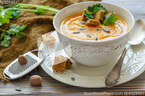 Image of Pumpkin soup with croutons and spices.