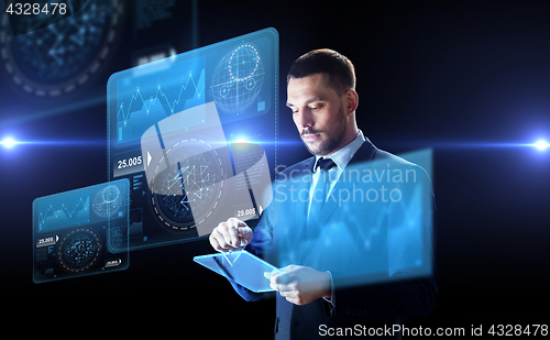 Image of businessman with tablet pc and virtual screens