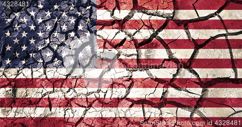 Image of american flag on cracked ground background