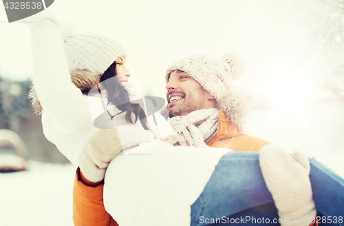 Image of happy couple outdoors in winter