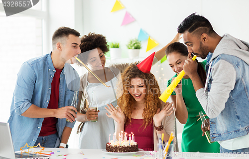 Image of team greeting colleague at office birthday party