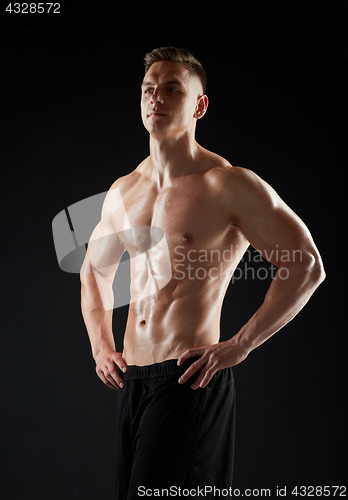 Image of young man or bodybuilder with bare torso