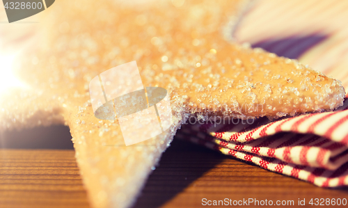 Image of close up of star gingerbread cookie and towel