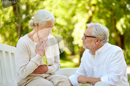 Image of senior woman feeling sick at summer park