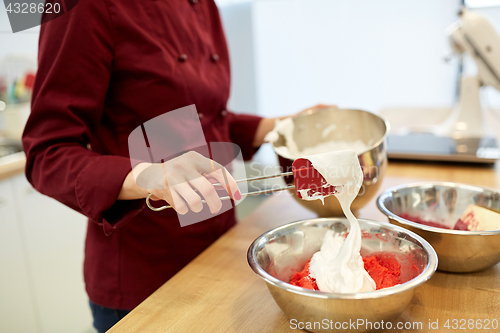 Image of chef making macaron batter at kitchen