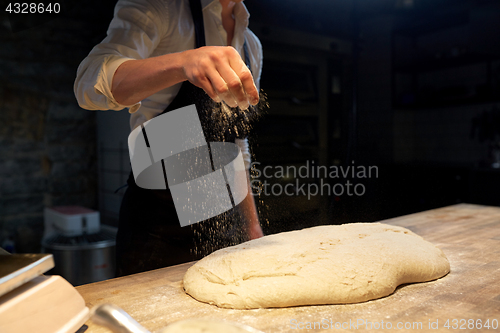 Image of chef or baker making bread dough at bakery