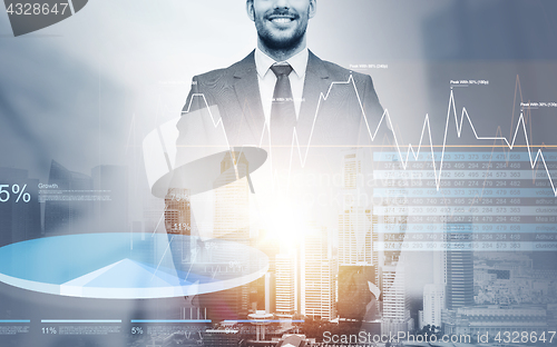 Image of close up of happy businessman over city background