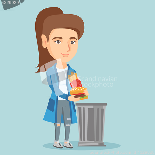 Image of Woman throwing out junk food into the trash can.