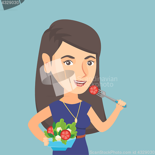 Image of Caucasian woman eating healthy vegetable salad.