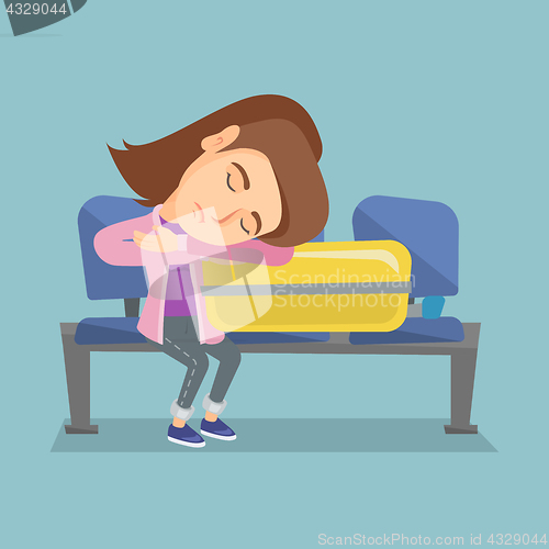 Image of Tired woman sleeping on suitcase at the airport.