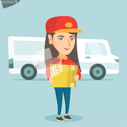 Image of Caucasian delivery courier holding a cardboard box