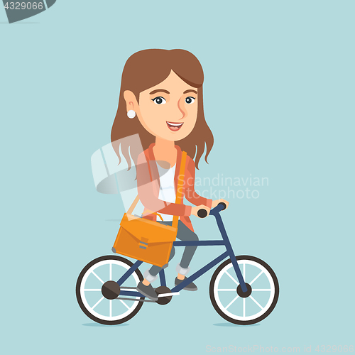 Image of Young caucasian business woman riding bicycle.
