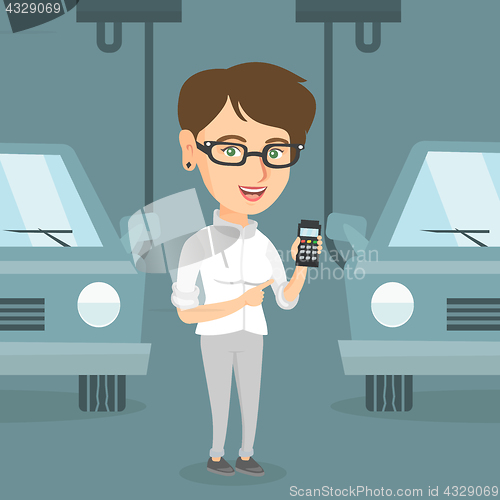 Image of Worker controlling automated assembly line for car