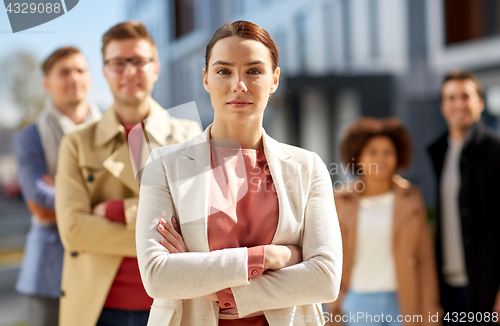 Image of woman in front of international team outdoors