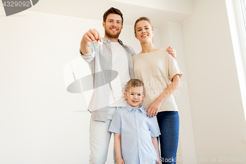 Image of happy family with key moving to new home