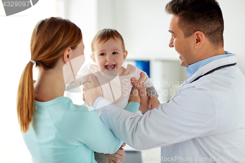 Image of happy woman with baby and doctor at clinic