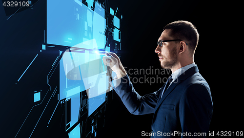 Image of businessman working with virtual screen