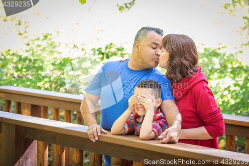 Image of Mixed Race Caucasian and Hispanic Family At The Park.