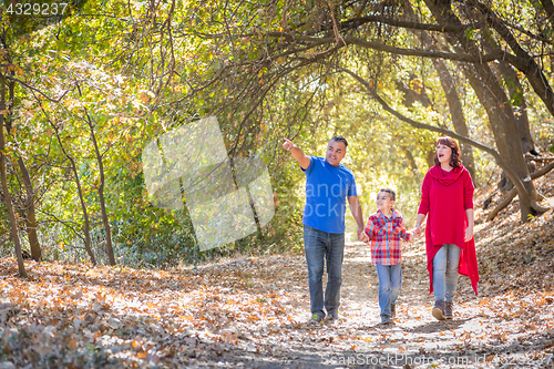 Image of Mixed Race Caucasian and Hispanic Family Taking a Walk At The Pa
