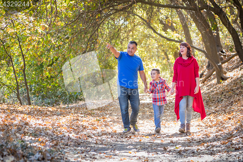 Image of Mixed Race Caucasian and Hispanic Family Taking a Walk At The Pa