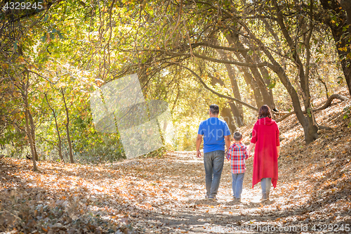 Image of Mixed Race Caucasian and Hispanic Family Taking a Walk At The Pa