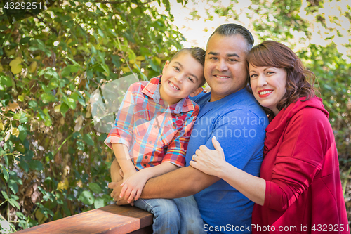 Image of Mixed Race Caucasian and Hispanic Family At The Park.