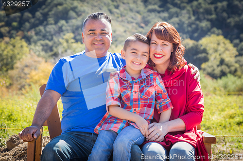 Image of Mixed Race Caucasian and Hispanic Family At The Park.