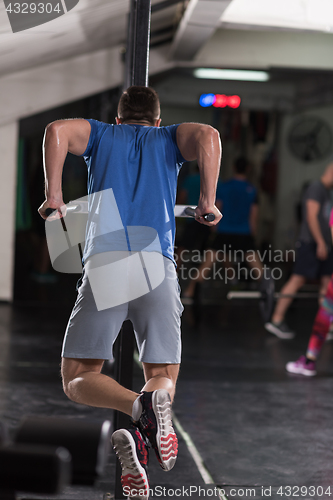 Image of man doing exercises parallel bars