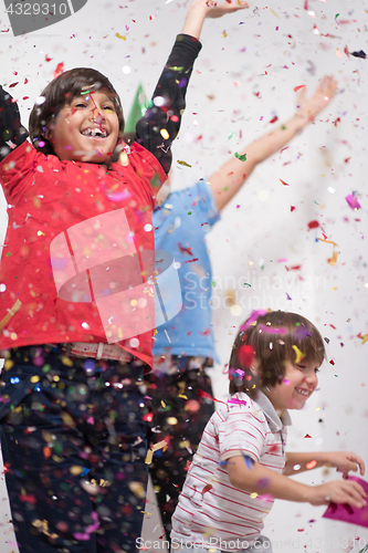 Image of kids  blowing confetti