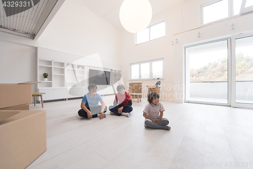 Image of young boys having fun on the floor