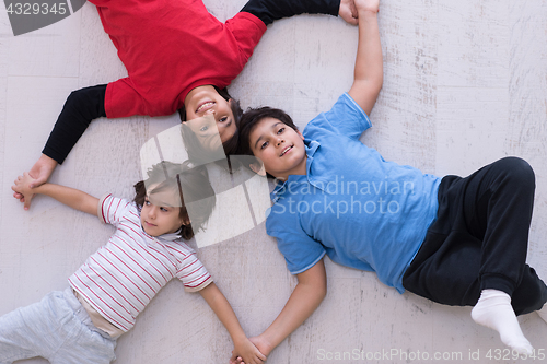 Image of young boys having fun on the floor