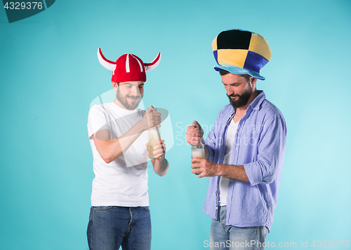 Image of Two Excited Male Friends Celebrate Watching Sports