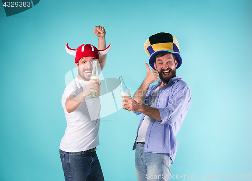 Image of Two Excited Male Friends Celebrate Watching Sports