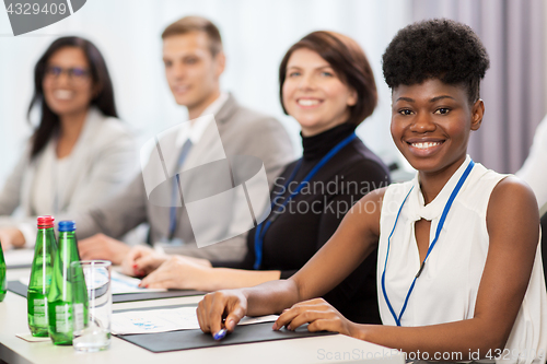 Image of happy business team at international conference