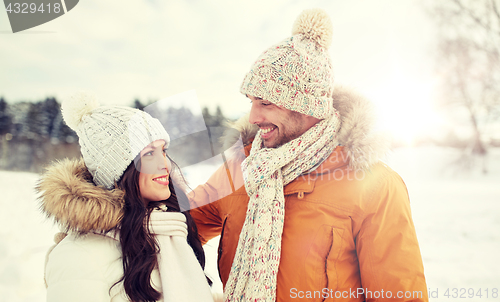 Image of happy couple walking over winter background