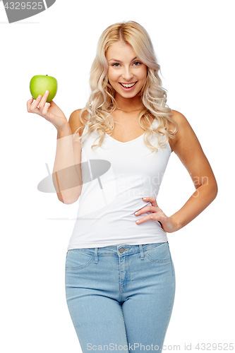 Image of happy beautiful young woman with green apple