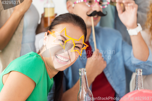 Image of happy woman with friends having fun at party