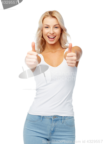 Image of happy young woman showing thumbs up