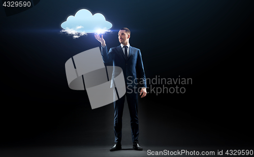 Image of businessman working with virtual cloud hologram