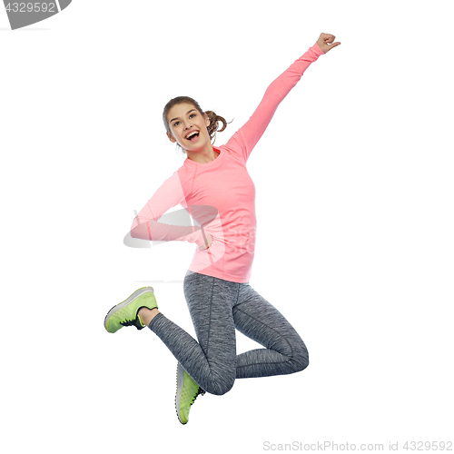 Image of happy smiling sporty young woman jumping in air