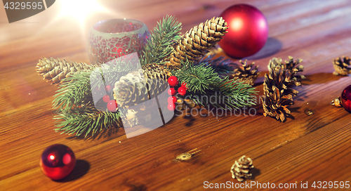 Image of christmas fir branch decoration and candle lantern