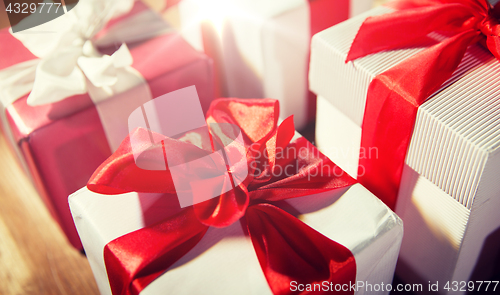 Image of close up of gift boxes on wooden floor