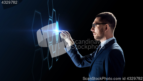 Image of businessman working with virtual network hologram